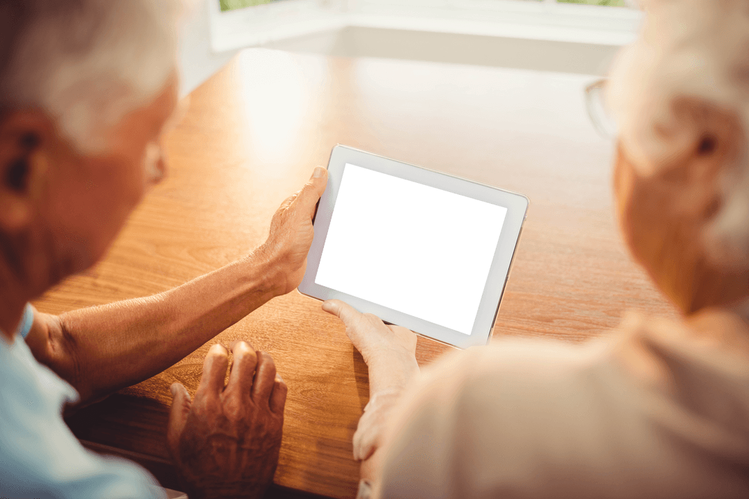 Senior Couple using Tablet with Transparent Screen at Home