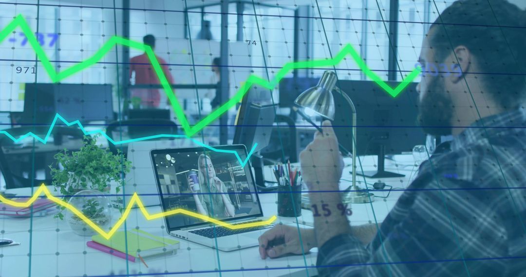 Worker Collaborating with Remote Colleague in Tech-Driven Office