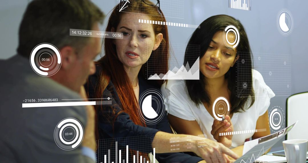 Diverse team collaborating on digital analytics dashboards with laptop and printed reports