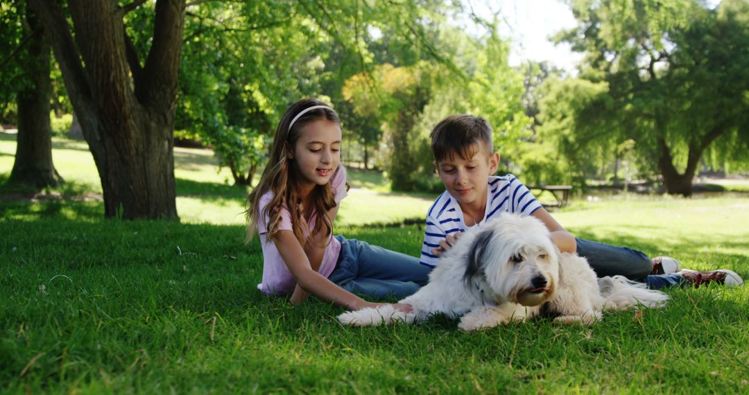 Children Playing with Dog on Lush Green Lawn in Park - Free Images, Stock Photos and Pictures on Pikwizard.com