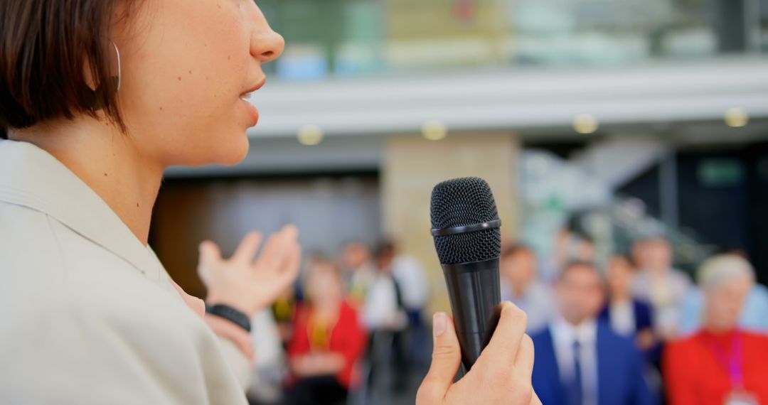 Female Speaker Engaging Audience at Business Seminar Close-Up