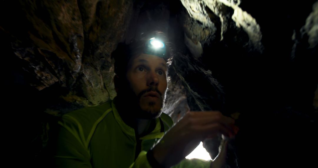 Explorer Wearing Headlamp in Dark Cave - Free Images, Stock Photos and Pictures on Pikwizard.com