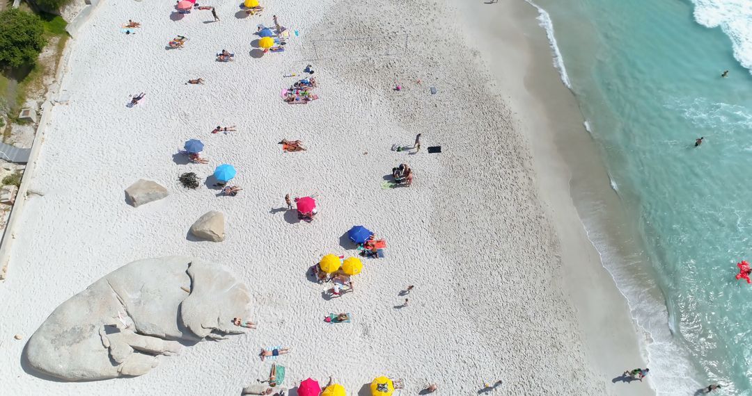 Aerial View of Sandy Beach with Colorful Umbrellas and Relaxing People - Free Images, Stock Photos and Pictures on Pikwizard.com