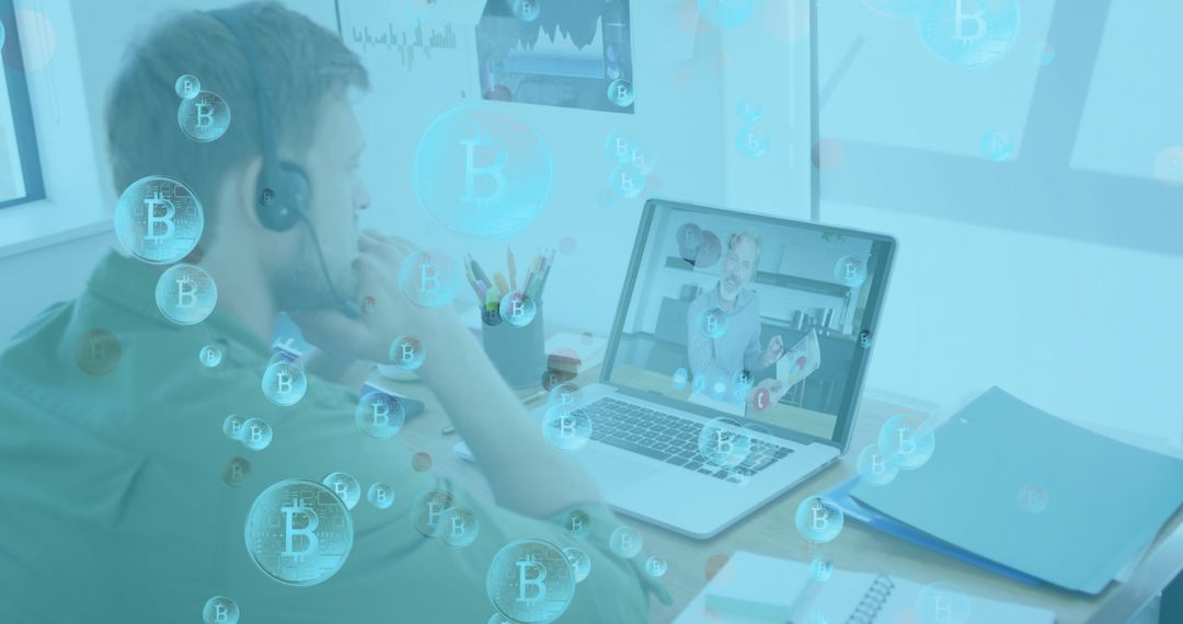 Man on Virtual Call Surrounded by Bitcoin Symbols