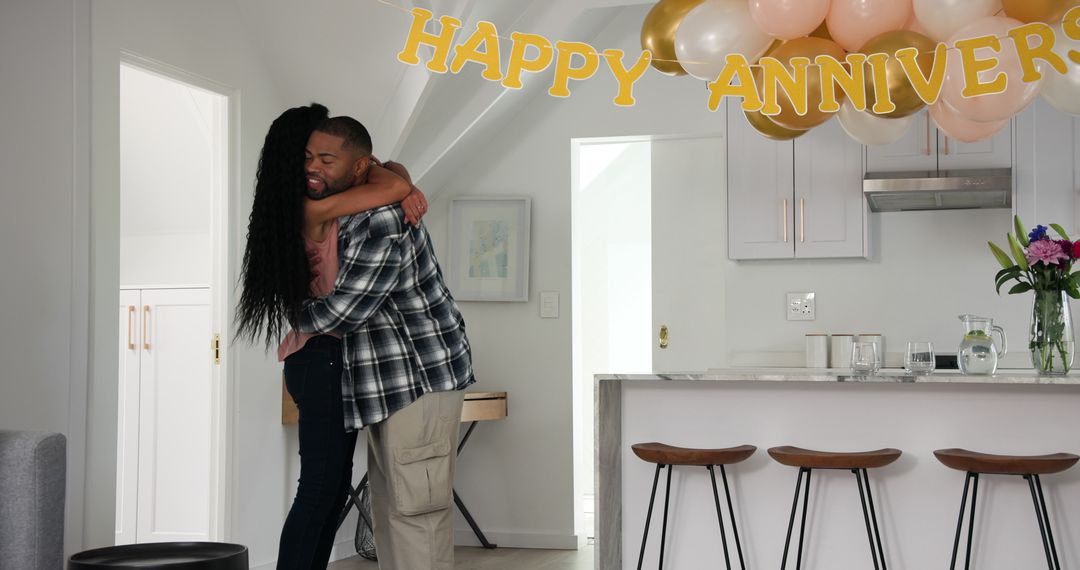 Happy couple hosting surprise anniversary celebration at home