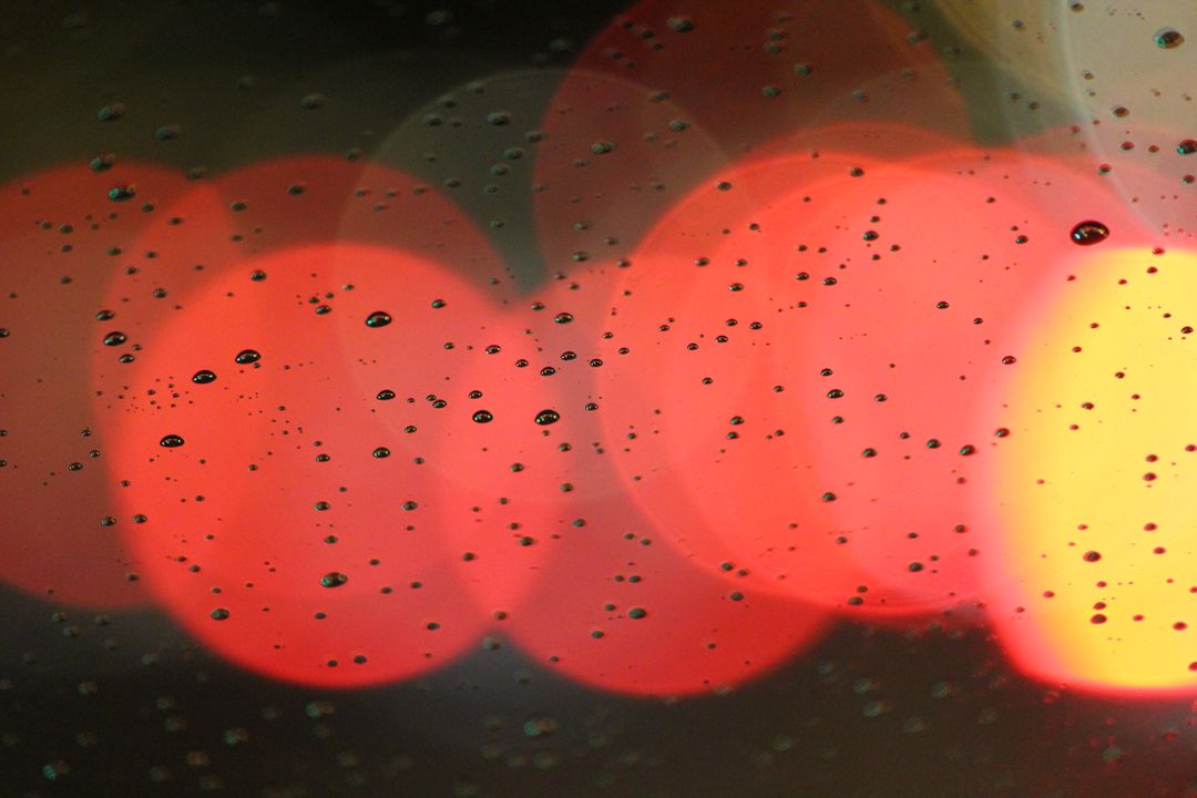 Close-up of Rain Droplets on Window at Night with Colorful Blurred Lights - Free Images, Stock Photos and Pictures on Pikwizard.com
