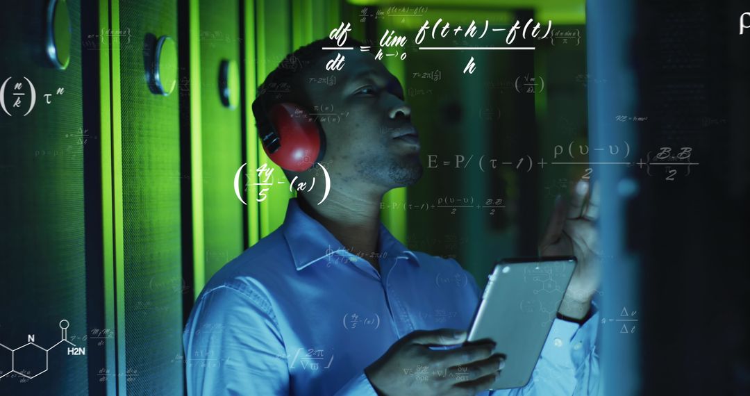 Engineer Analyzing Data with Digital Tablet in Server Room