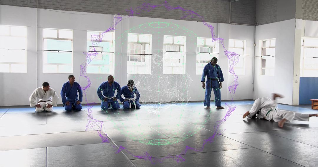 Judo Class Training in Gis Performing Throws and Rolls in Bright Natural-Light Dojo