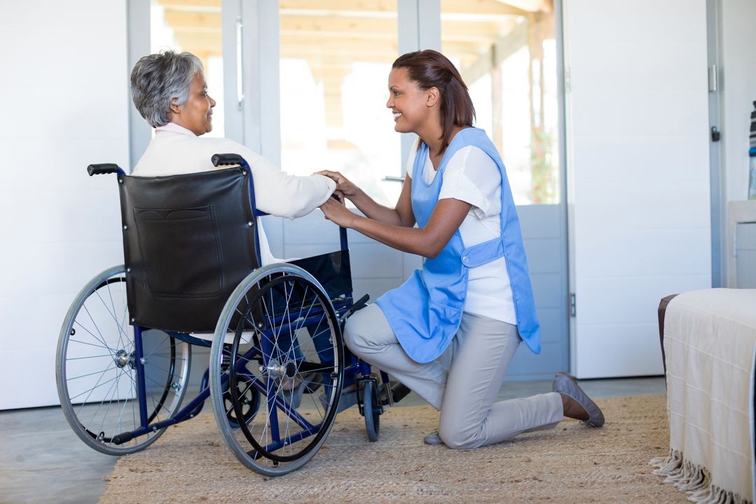 Female doctor interacting with senior woman on wheelchair - Free Images, Stock Photos and Pictures on Pikwizard.com