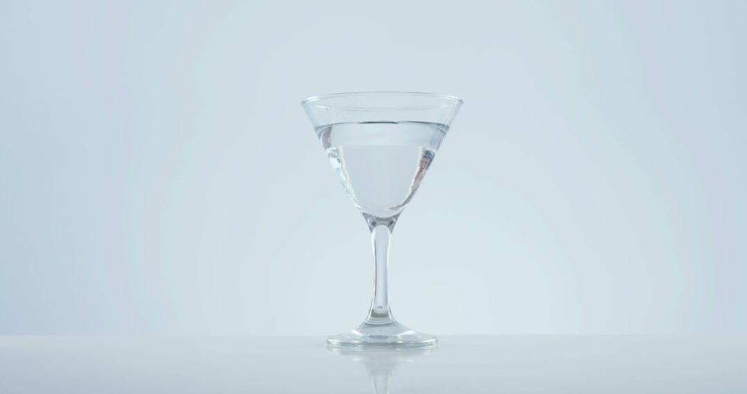 An elegant martini glass against a light backdrop evokes a refined atmosphere for upscale events. - Free Images, Stock Photos and Pictures on Pikwizard.com
