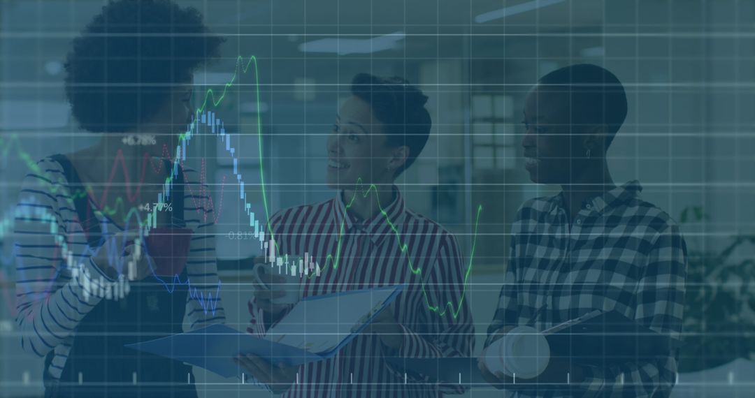Multiracial Colleagues Analyzing Business and Financial Graphs in Office