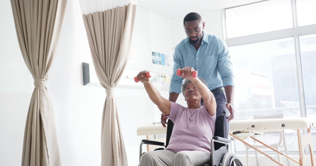 Physical Therapist Assisting Elderly Woman with Arm Exercises - Free Images, Stock Photos and Pictures on Pikwizard.com