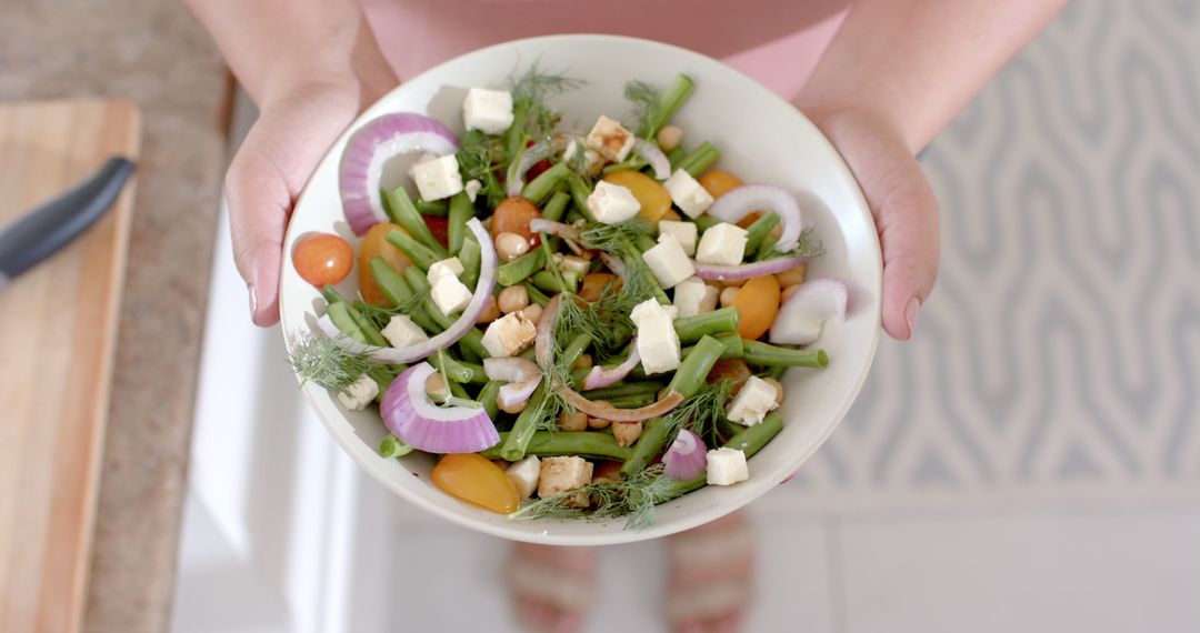 Fresh Mixed Vegetable Salad with Feta Cheese in Kitchen