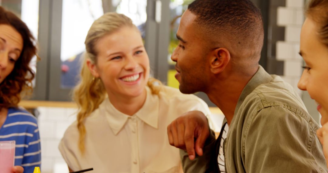 Diverse Friends Engaging in Lively Conversation at Cafe
