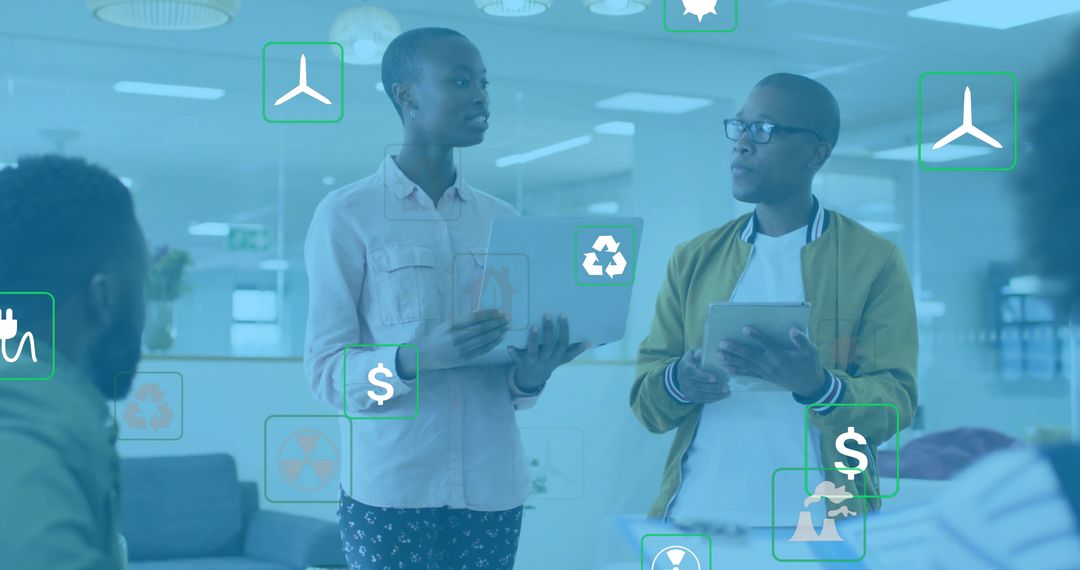 Colleagues Analyzing Energy Use with Technology in Innovative Office