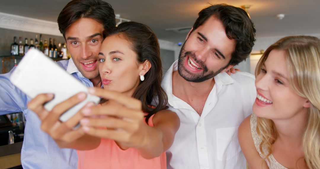 Group of Friends Taking Selfie in Bar, Smiling and Enjoying Time Together - Free Images, Stock Photos and Pictures on Pikwizard.com