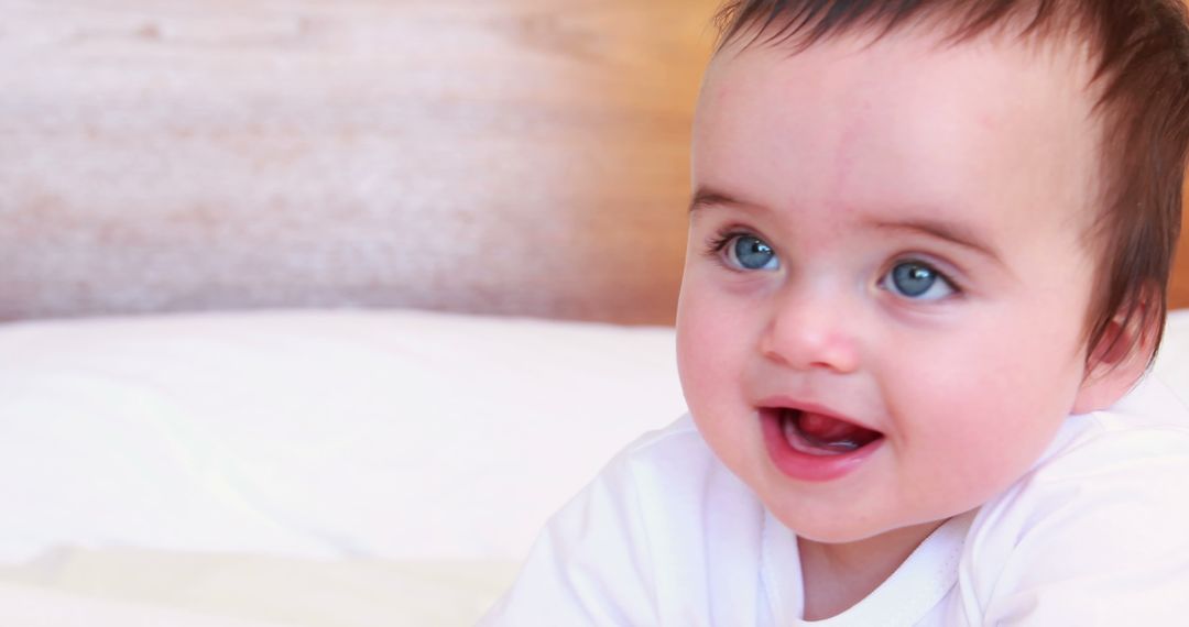 Smiling Baby with Blue Eyes and White Shirt - Free Images, Stock Photos and Pictures on Pikwizard.com