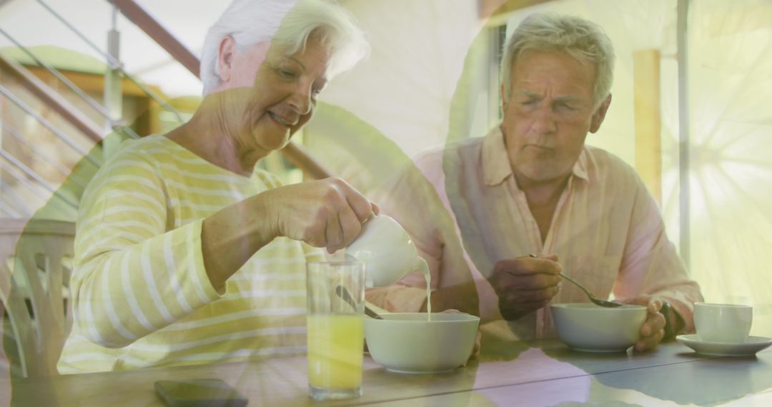 Senior Couple Enjoying Breakfast with Overlay of Citrus Slices
