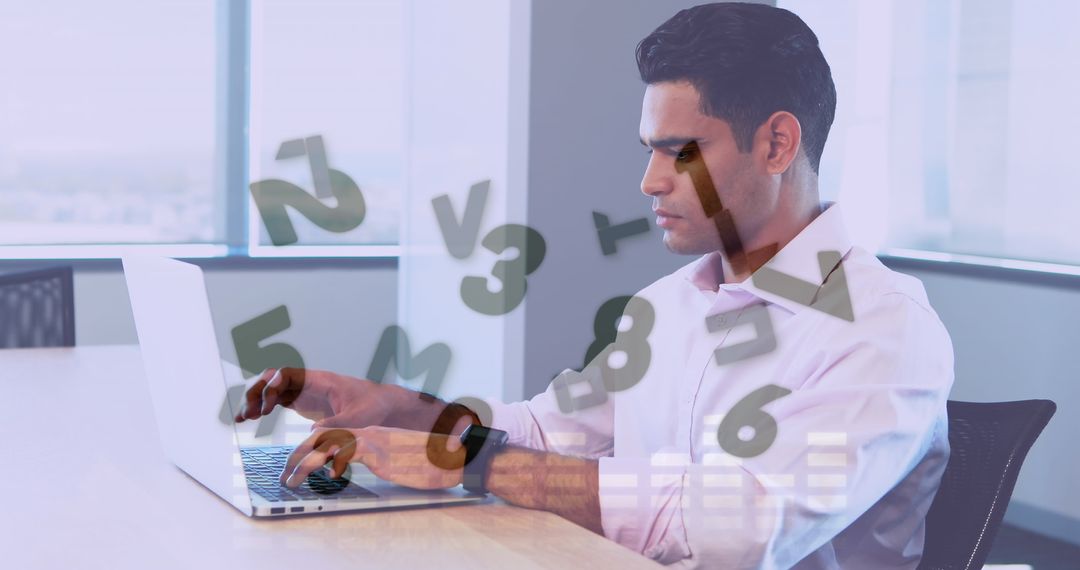 Businessman Using Laptop for Data Processing in Modern Office