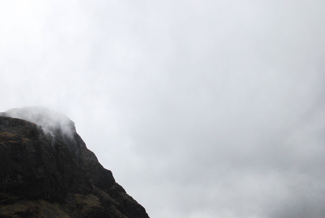 Foggy Mountain Peak with Overcast Sky - Free Images, Stock Photos and Pictures on Pikwizard.com