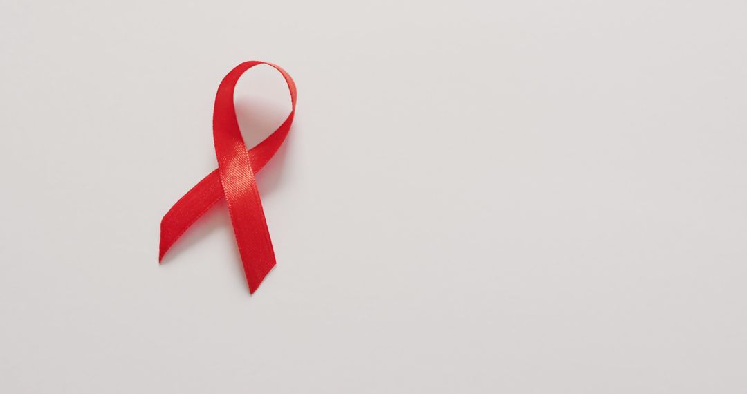 Image of red blood cancer ribbon on white background - Free Images, Stock Photos and Pictures on Pikwizard.com