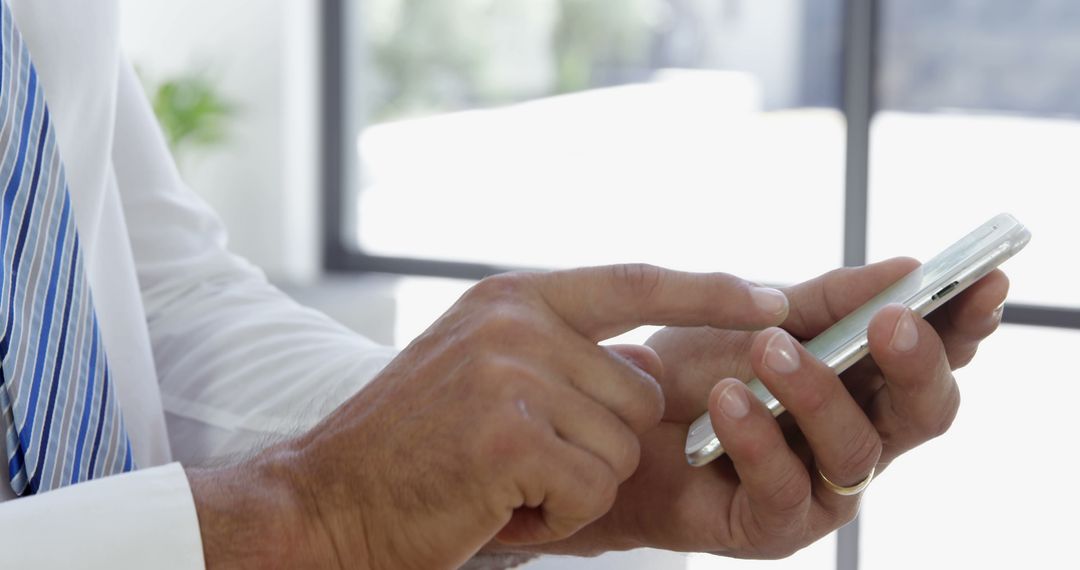 Close-up of Businessman Using Smartphone for Communication