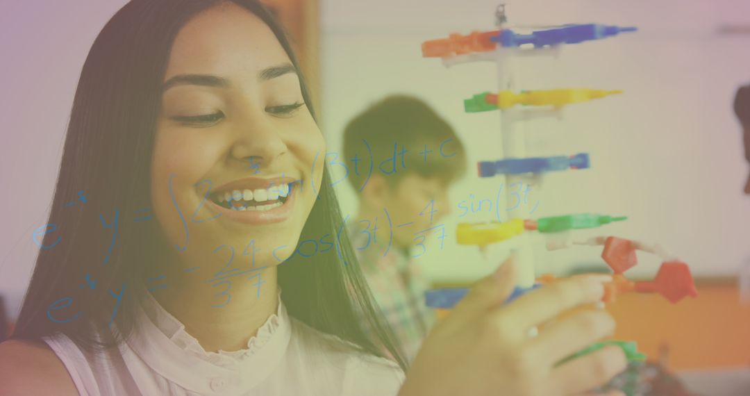 Smiling Student Exploring Math with Molecular Model
