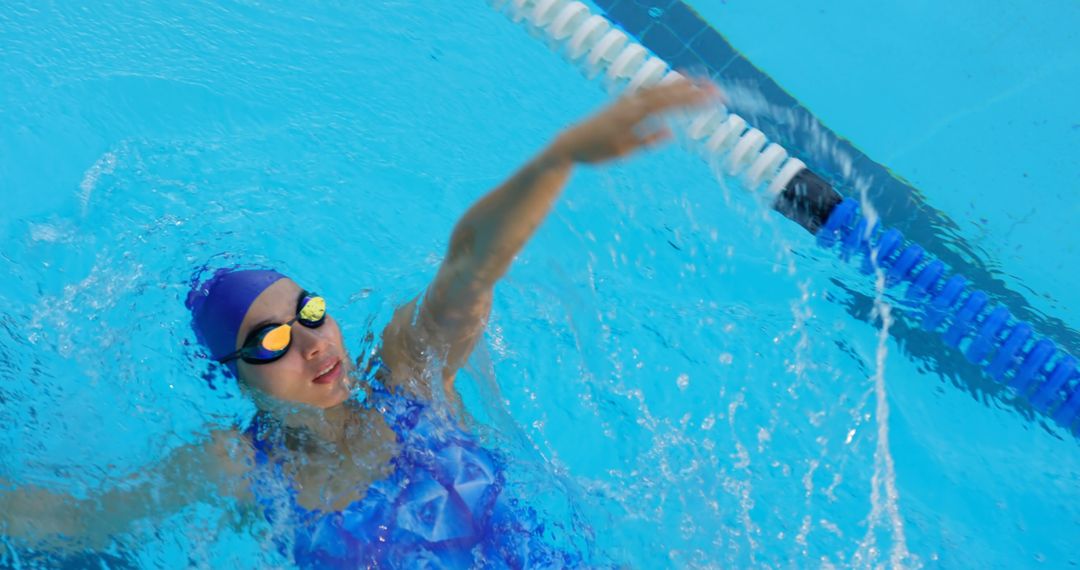 Professional Swimmer Practicing Lane Swimming in Pool - Free Images, Stock Photos and Pictures on Pikwizard.com