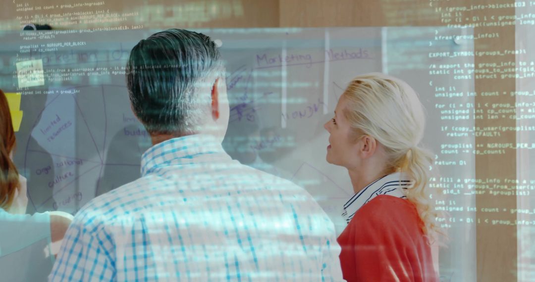 Professionals Collaborating on Strategy with Digital Elements