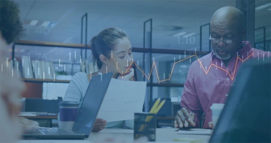 Business Professionals Collaborating Over Important Documents