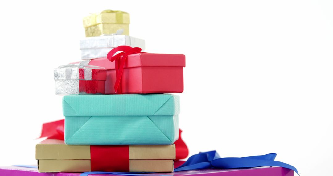 Colorful Pile of Wrapped Gift Boxes Against White Background - Free Images, Stock Photos and Pictures on Pikwizard.com