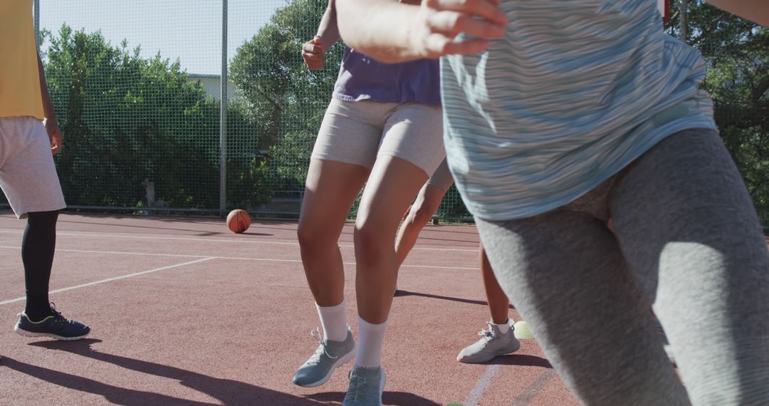 Close-Up of Athletic People Playing Outdoor Basketball - Free Images, Stock Photos and Pictures on Pikwizard.com