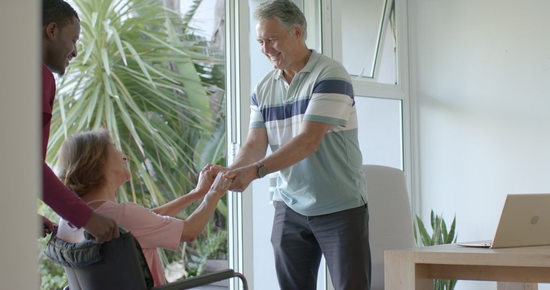 Seniors Enjoying Friendly Home Conversation with Smiling Young Guest