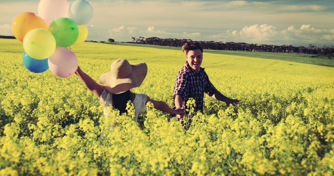 Happy Couple Enjoying Summer Field With Colorful Balloons - Free Images, Stock Photos and Pictures on Pikwizard.com