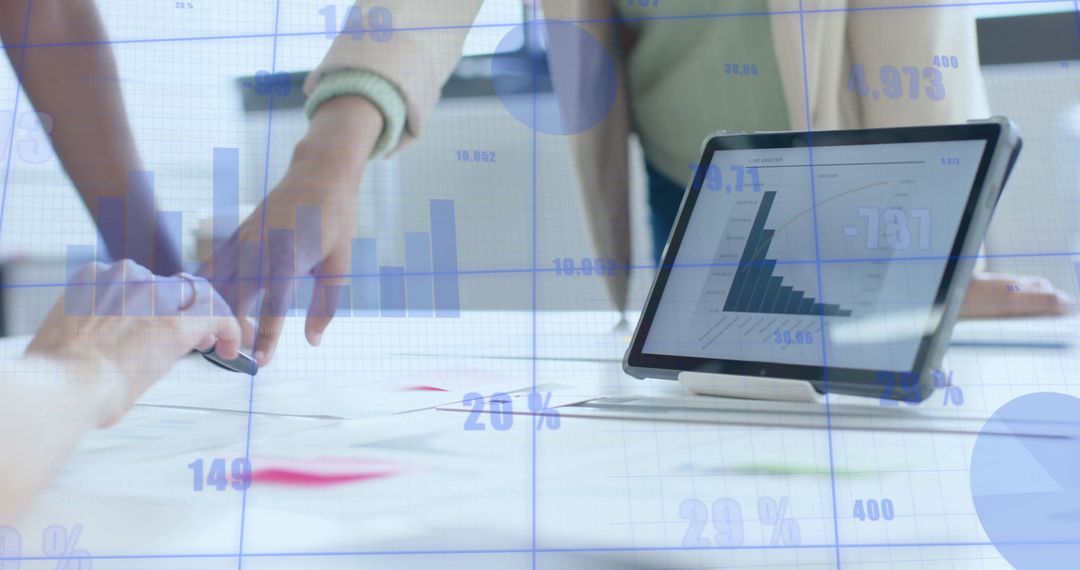 Modern Business Colleagues Analyzing Financial Data on Tablet