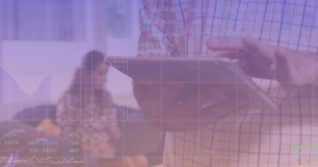 Business Professional Analyzing Stock Data on Tablet