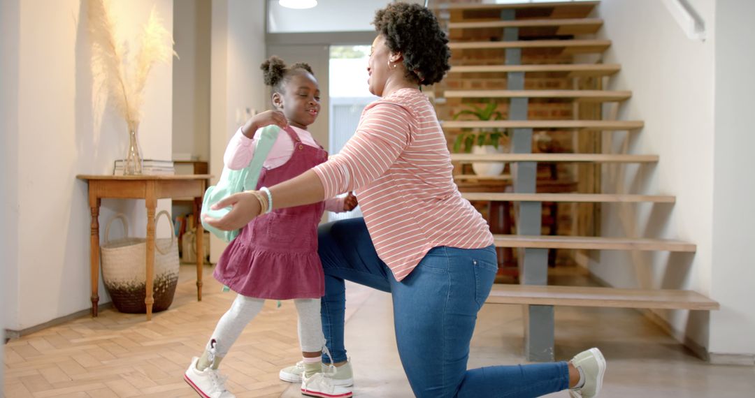Mother Hugging Daughter on First Day of School