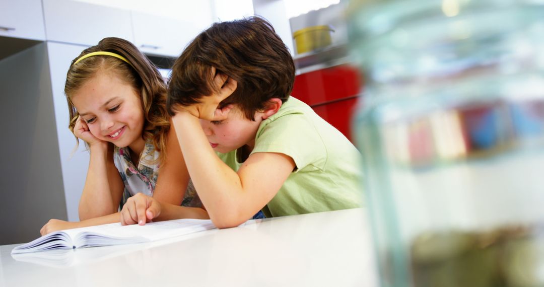 Children Studying Together in Home Kitchen - Free Images, Stock Photos and Pictures on Pikwizard.com