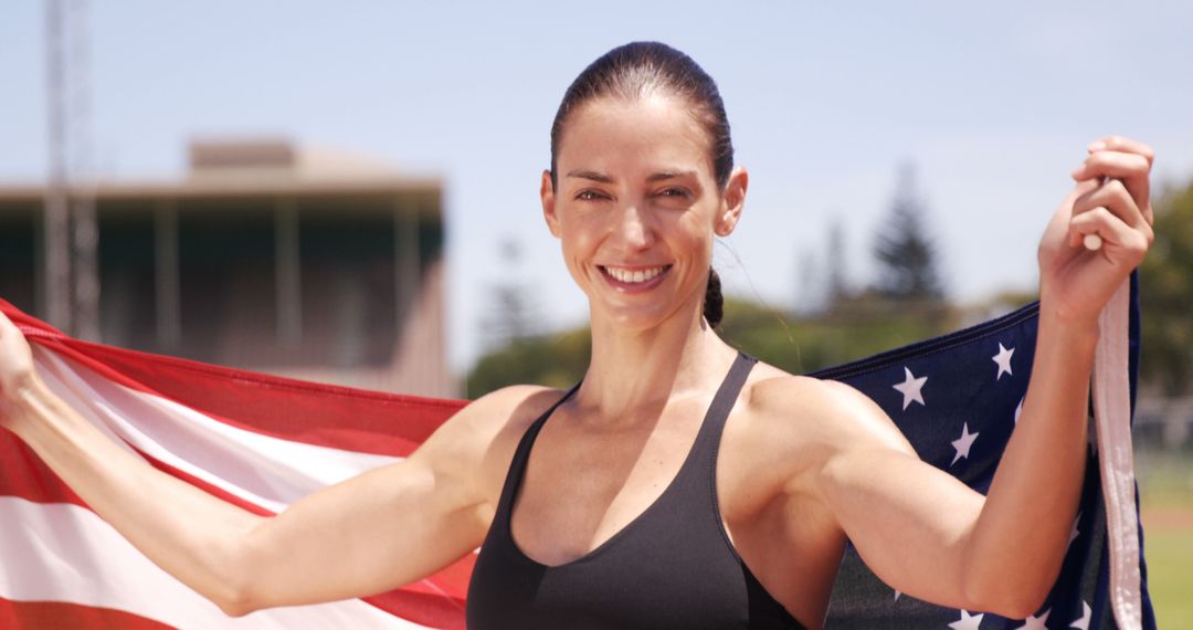 Fit woman celebrating with USA flag outdoors - Free Images, Stock Photos and Pictures on Pikwizard.com