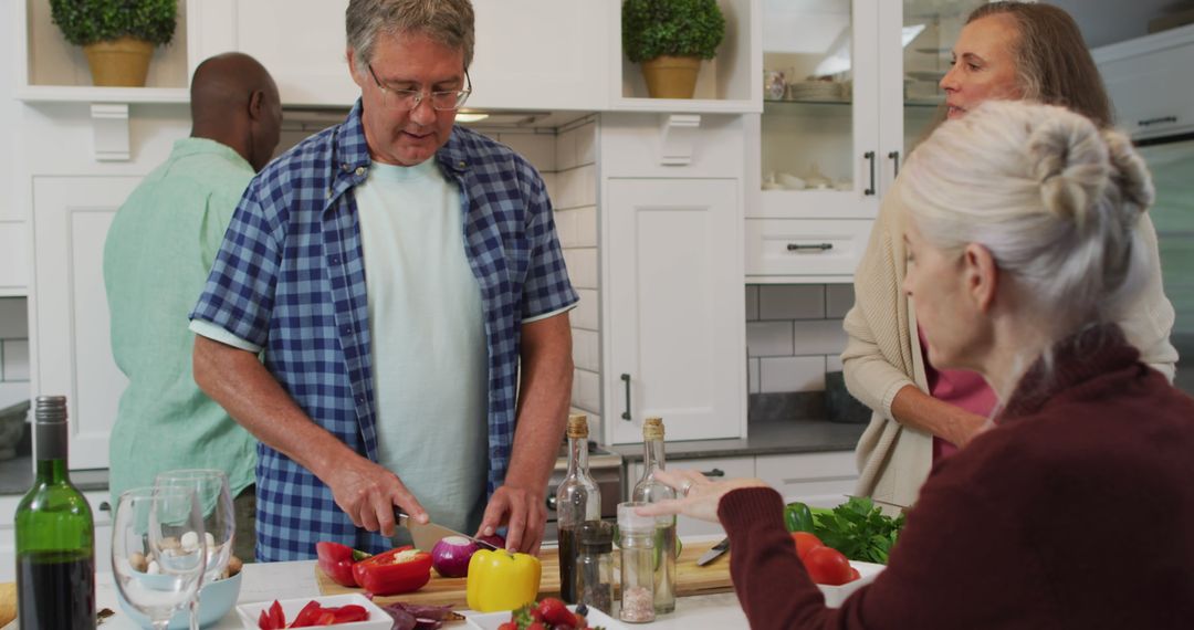 Group of diverse seniors preparing healthy meal in kitchen - Free Images, Stock Photos and Pictures on Pikwizard.com