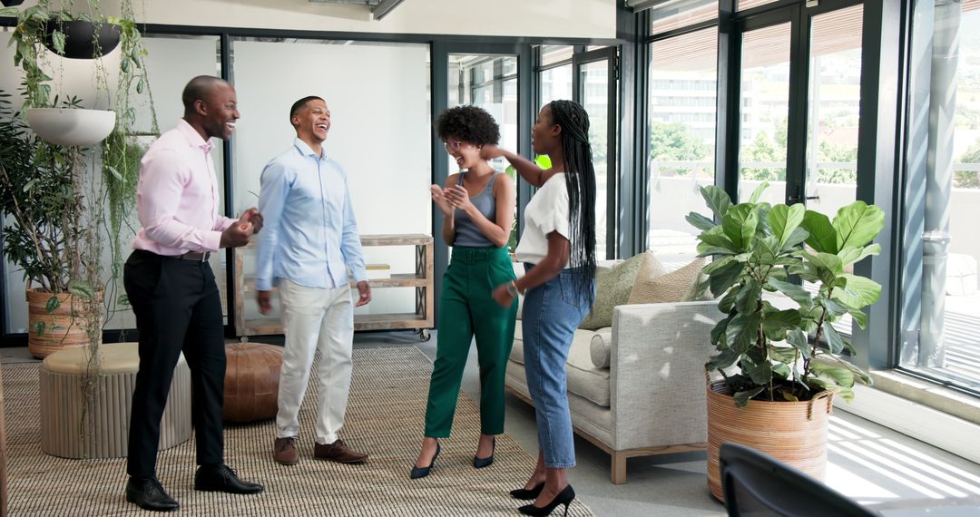 Diverse Colleagues Collaborating Joyfully in Stylish Office