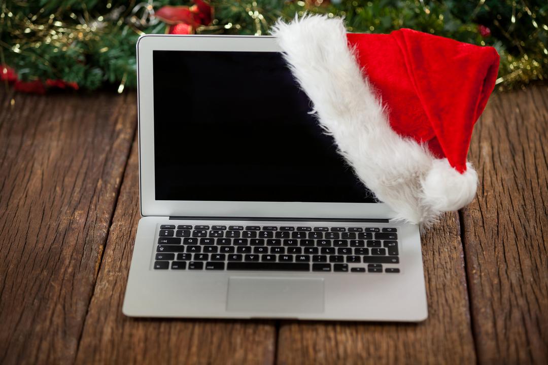 Laptop with santa hat - Free Images, Stock Photos and Pictures on Pikwizard.com