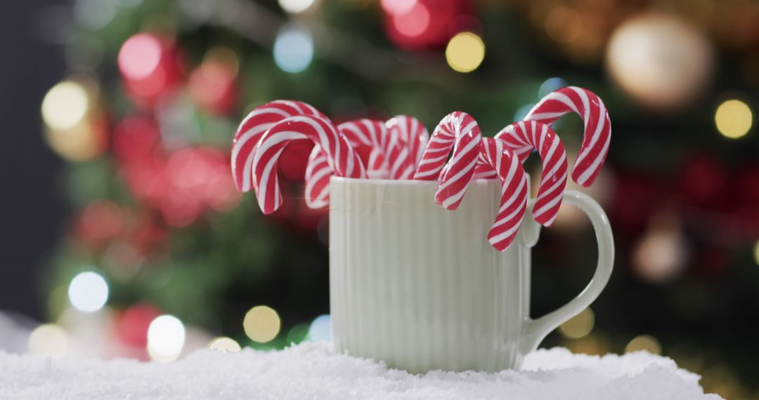 Festive Candy Canes in Mug with Christmas Tree Lights