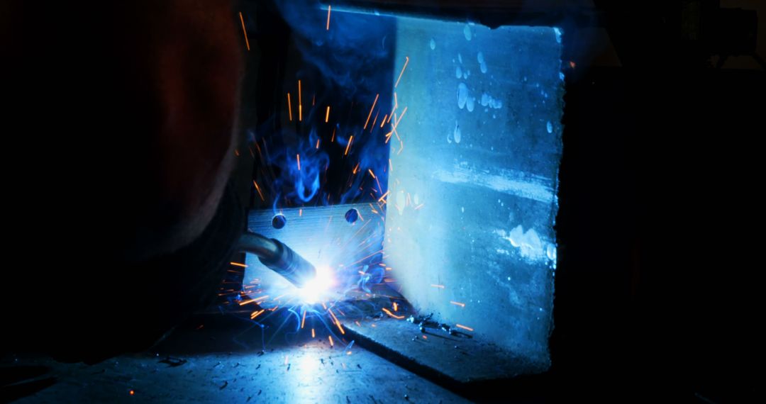 Industrial Welding with Bright Sparks in Workshop - Free Images, Stock Photos and Pictures on Pikwizard.com