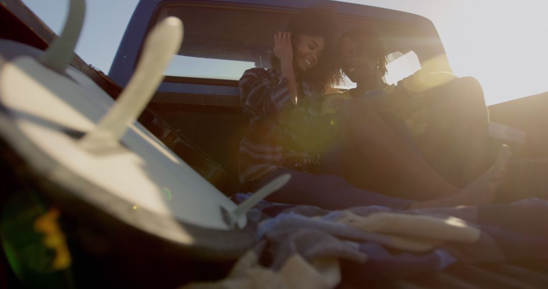 Friends Enjoying Sunset in Pickup Truck Bed - Free Images, Stock Photos and Pictures on Pikwizard.com