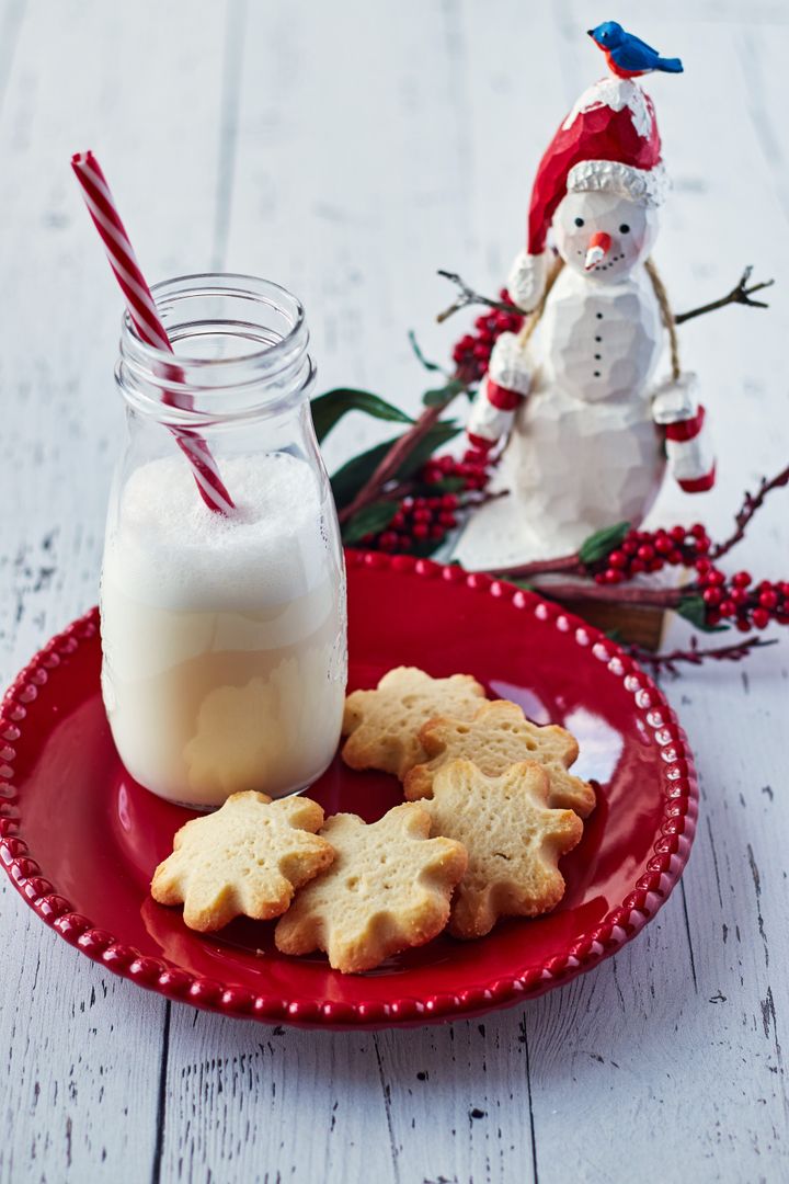 Festive Snowflake Cookies with Milk and Snowman Decor