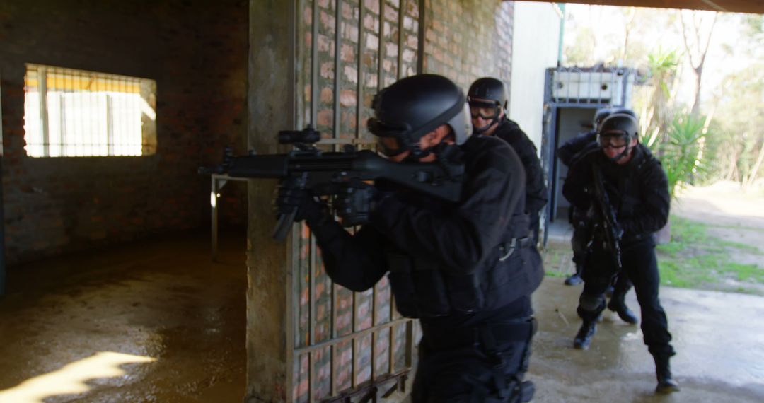 SWAT Team in Tactical Action Outside Building During Raid - Free Images, Stock Photos and Pictures on Pikwizard.com