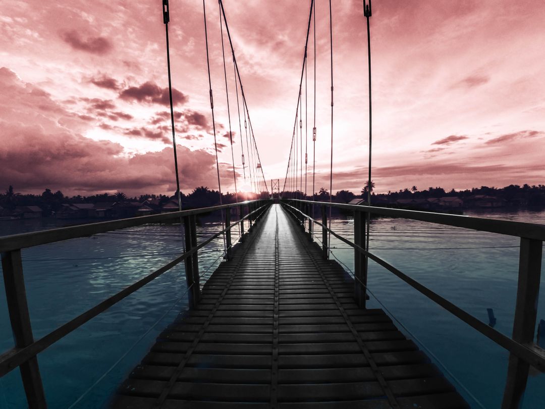 Suspension Bridge at Sunset with Dramatic Sky - Free Images, Stock Photos and Pictures on Pikwizard.com