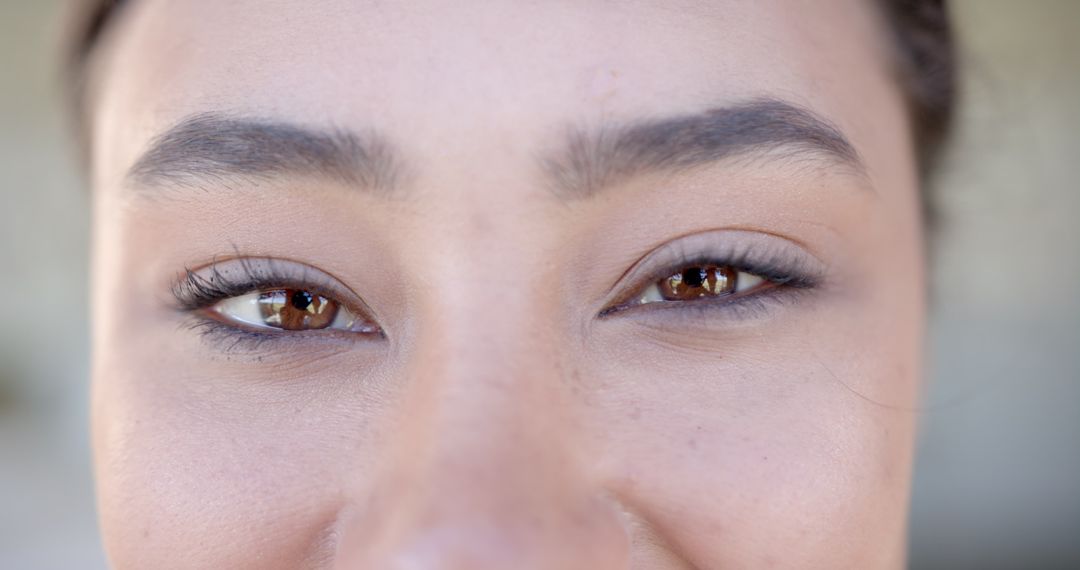 Close-Up of Woman's Eyes with Well-Groomed Eyebrows and Natural Makeup