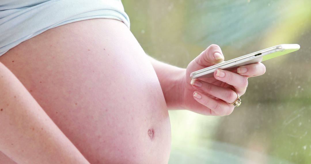 Pregnant Woman Using Smartphone at Home - Free Images, Stock Photos and Pictures on Pikwizard.com